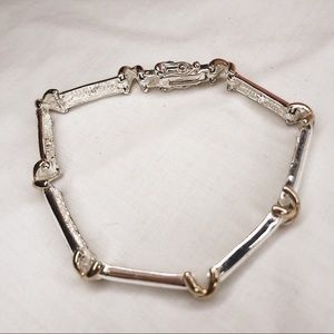 Silver Tinted Link Bracelet with X Shaped Links